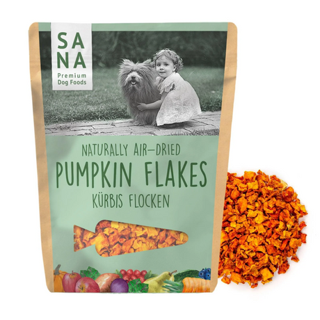 Bag of Sana Air Dried Pumpkin flakes with pumpkin flakes in the background.