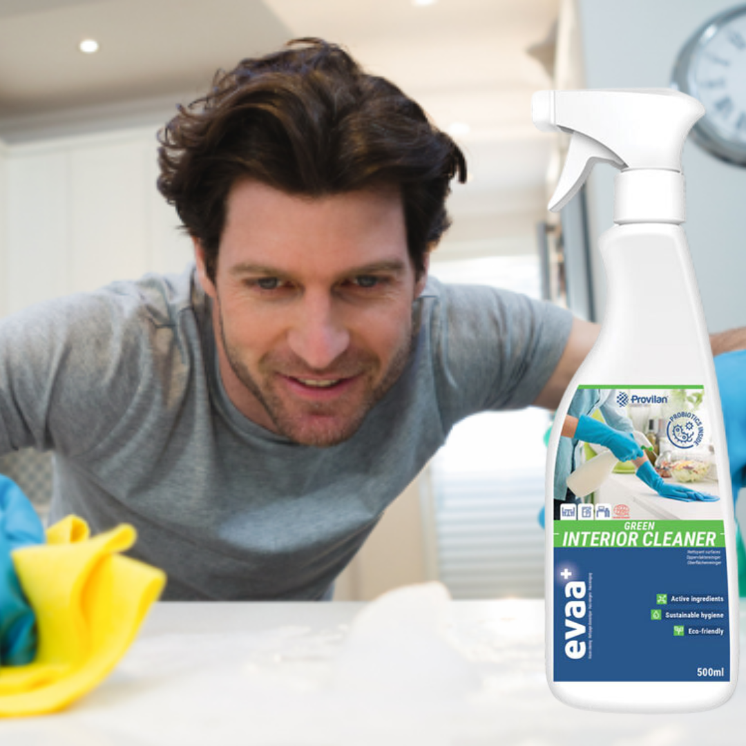 Man cleaning a counter with Provilan Evaa Probiotic Green Interior Cleaner.