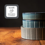 Three ceramic stoneware Scruffs pet bowl stacked, alongside a sticker saying "Scruffs, Each bowl is unique".