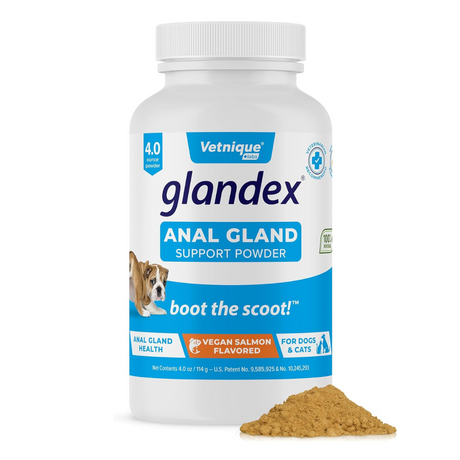 Tub of Glandex Anal Gland Support Powder with a small mound of the powder in the foreground.